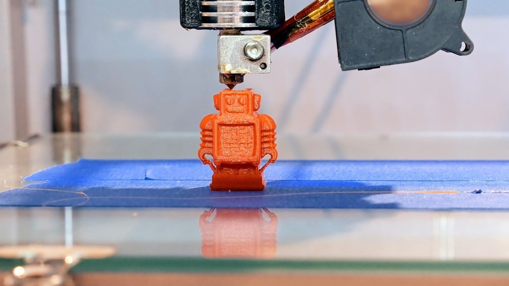 Automatic three dimensional 3d printer performs product creation. Modern 3D printing or additive manufacturing and robotic automation technology.