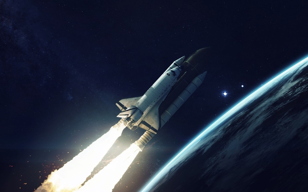 Space shuttle orbiting Earth planet. Elements of this image furnished by NASA