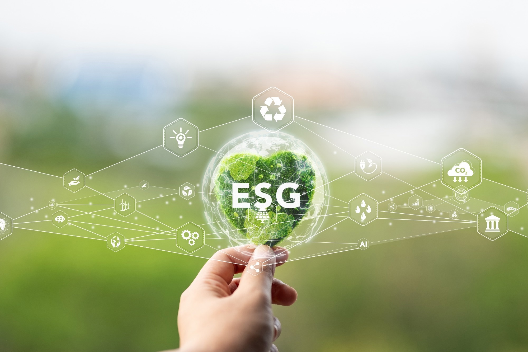 E.S.G. Environment Social Governance. Hand holding a heart with a green globe inside. Network lines with icons on green background. Ideas for investing in green businesses for long-term sustainability.