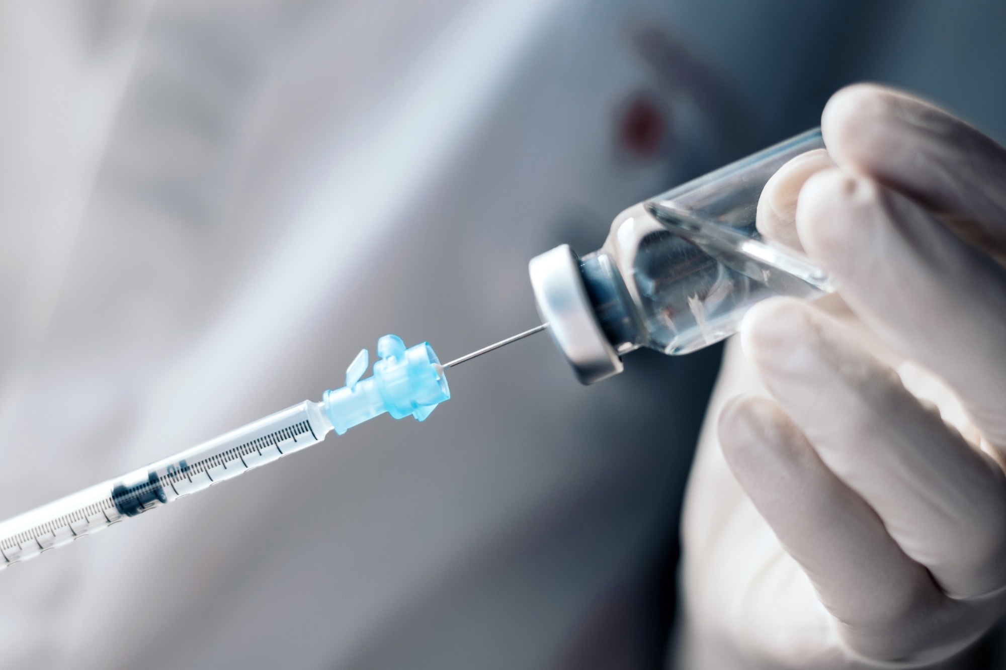 Injecting vaccination medicine into a syringe.
