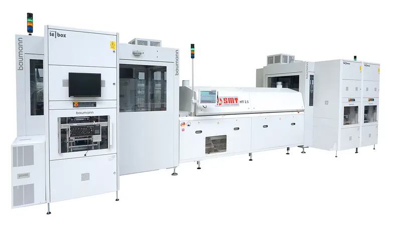The complete test line consists of two linked test cells with docked test stations. The oven for heating the circuit boards is shown in the center of the photo