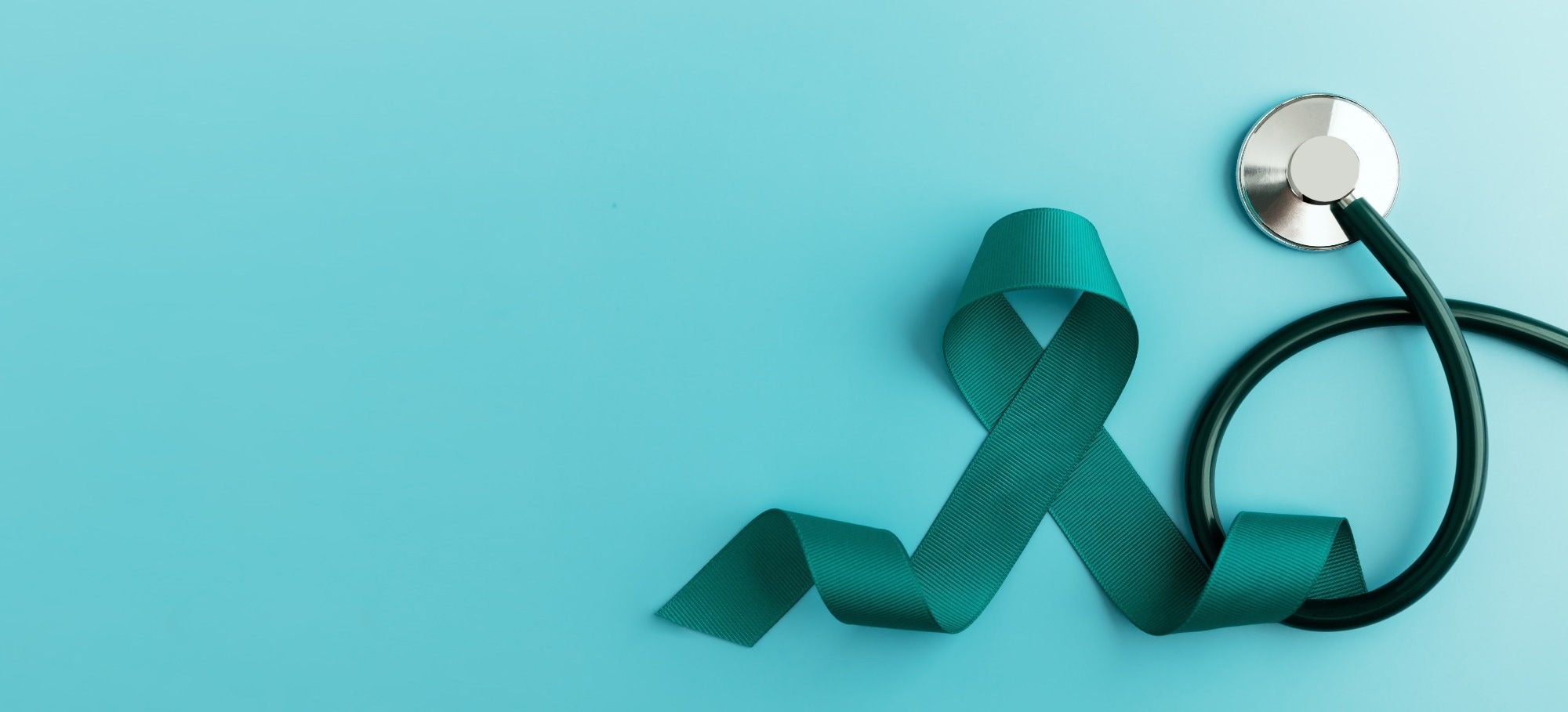Ovarian and Cervical Cancer Awareness. Image shows a Teal Ribbonin with Stethoscope in Top View.