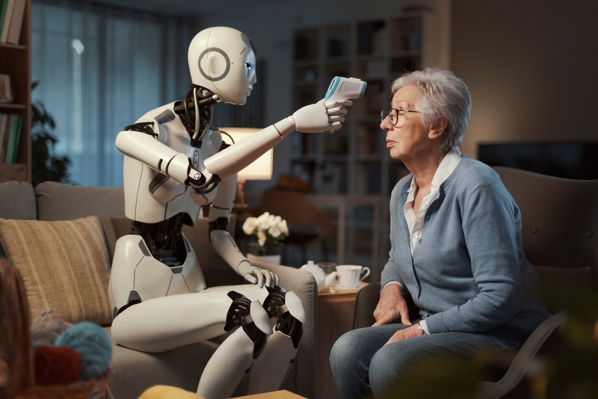 A lady in a care home has her fever measured by her android assistant, using an infrared thermoscanner.
