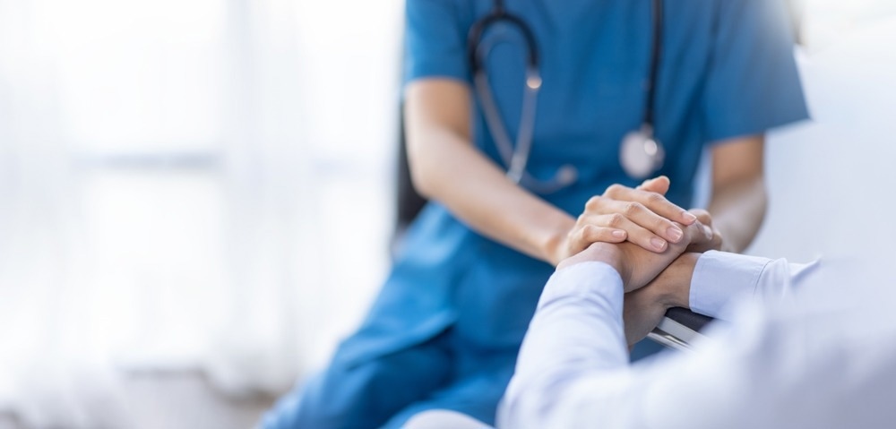 nurse holding patient