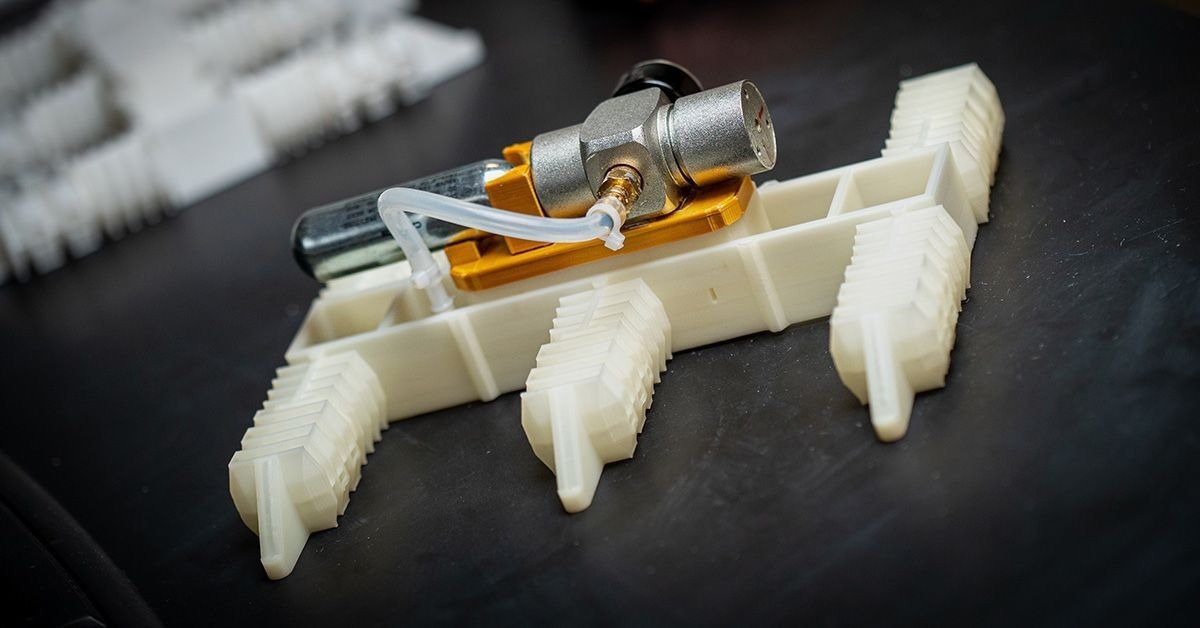 The image shows a 3D-printed robot