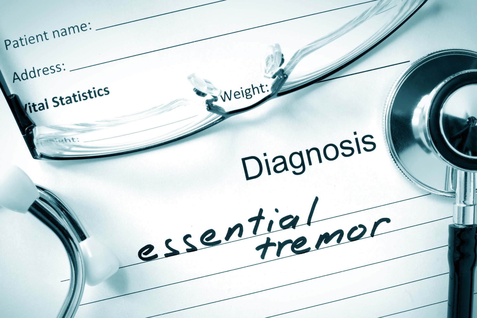 Form with diagnosis Essential tremor and tablets. Medical concept.
