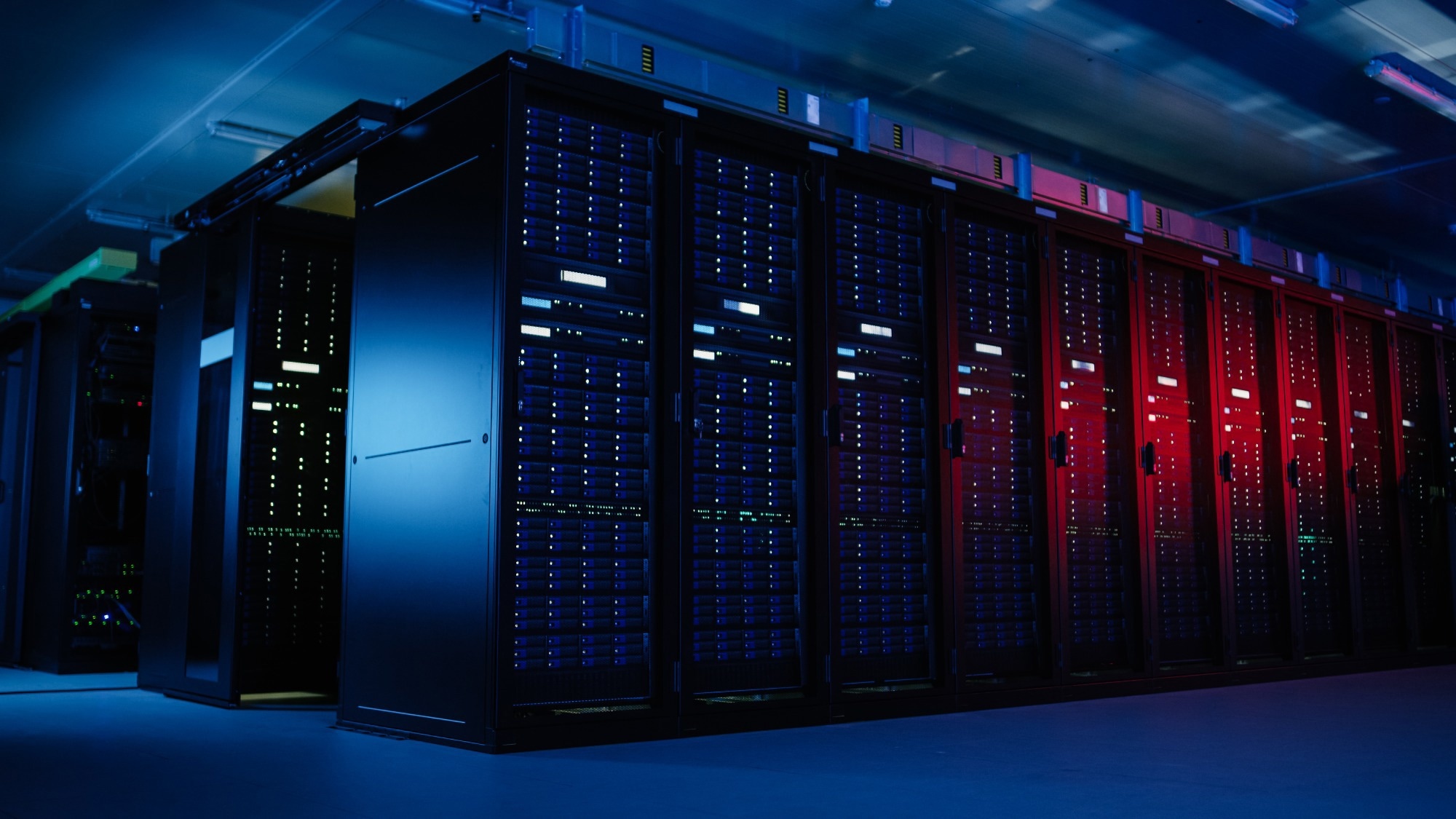 Shot of Data Center With Multiple Rows of Fully Operational Server Racks.