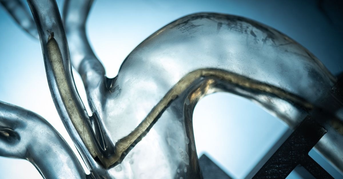 Soft Robotic Skin Guides Millimeter-Sized Vine Robots Through Complex Paths