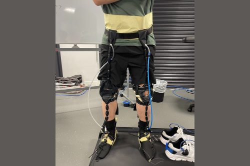 man stood with soft robotic exosuit