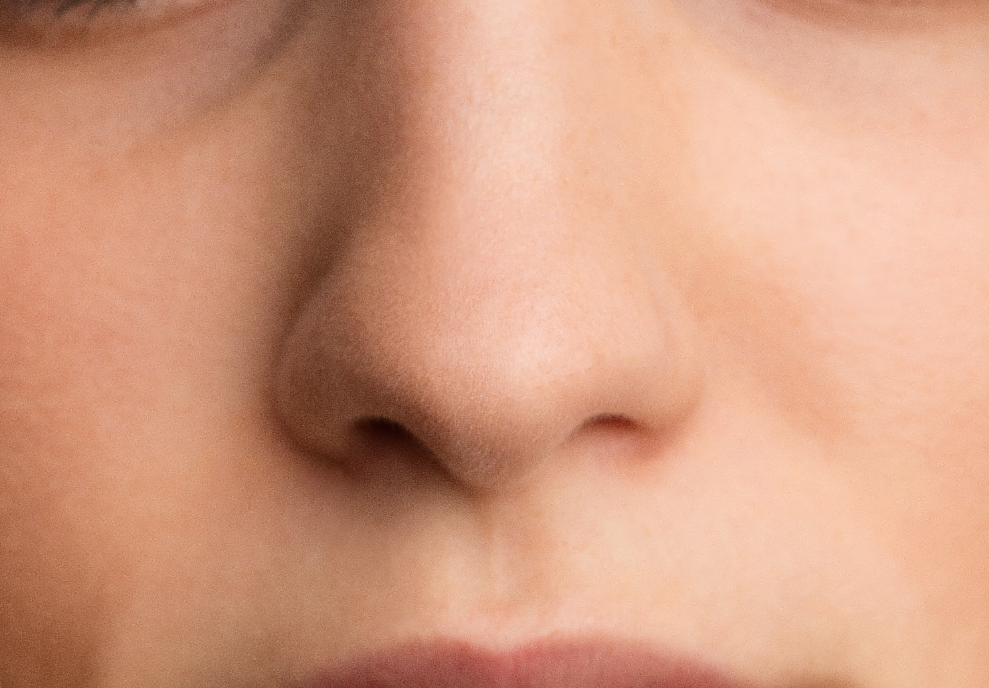 Close up photograph of a human nose.