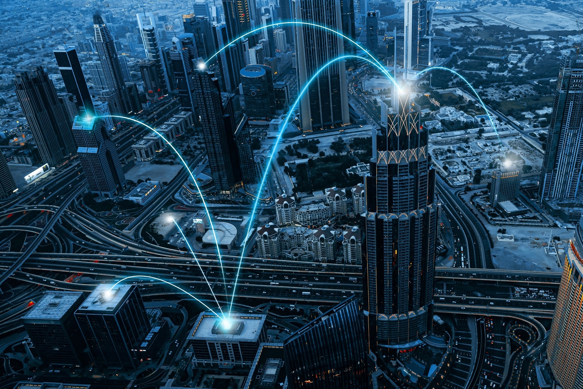 Large city with multiple skyscrapers and busy roads. Technology connection imagery superimposed