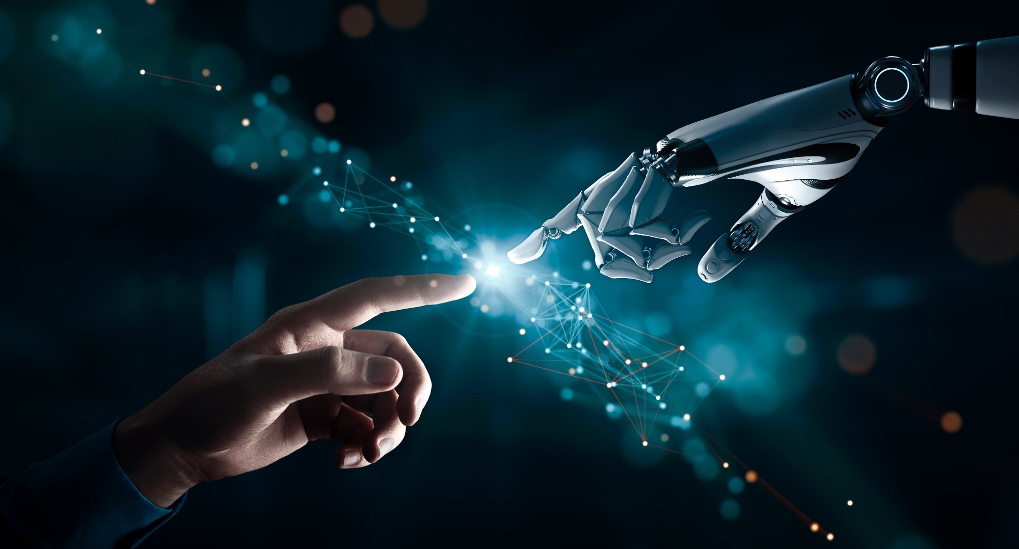 Human hand touching a humanoid robot hand