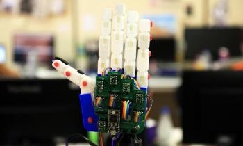Humanoid Programmed to Communicate with Deaf People Through Sign Language