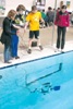 Students from Maywood Demonstrate the Capability of Robots in Prevention of Oil Spill