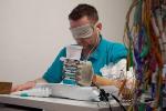 Sensory-Enhanced Prosthetic Hand Surgically Wired to Nerves of Amputee