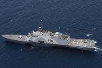 Unmanned Fire Scout Helicopter Simultaneously Flown with Sea Hawk Helicopter