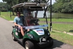 Self-Driving Golf Carts Ferry Tourists Around Winding Paths in Large Singaporean Public Garden