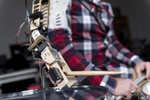 Wearable Robotic Limb Allows Drummers to Play with Three Arms