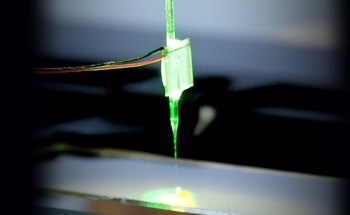 A Novel Robotic Arm with Ultrasonically Actuated Glass Needle